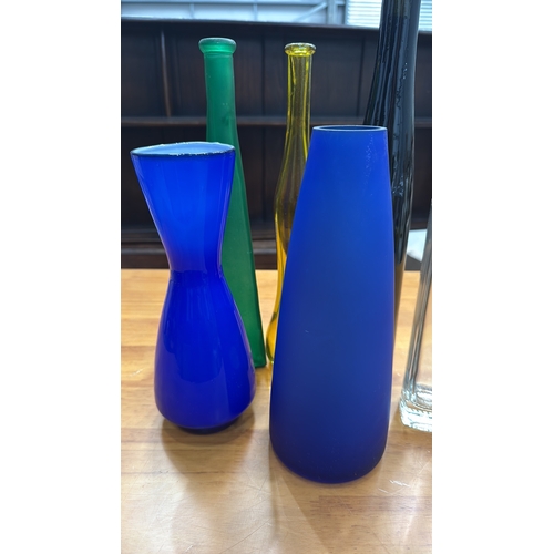 324 - Set of six decorative blown and moulded glass vases/bottles in cobalt, emerald, amber, clear and obs... 