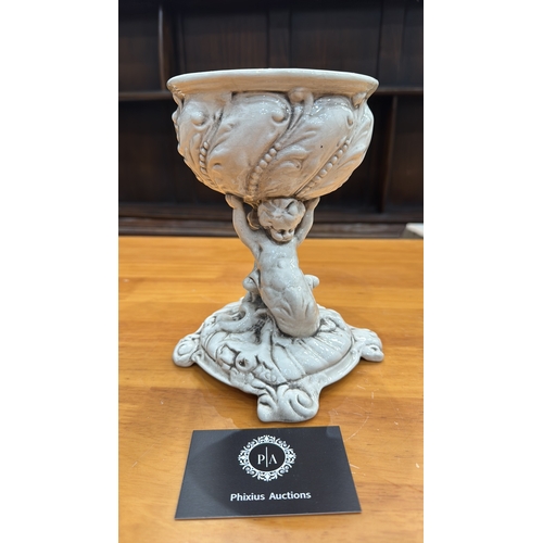 331 - Ornate glazed porcelain tazza with shell-form bowl supported by a cherub on rocaille base, underside... 