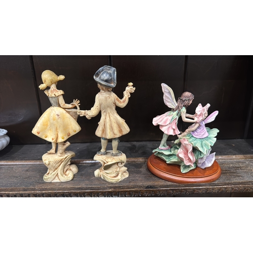 352 - Set of three figural ornaments: Italian “Depose Italy” painted composition figures of a barefoot gir... 