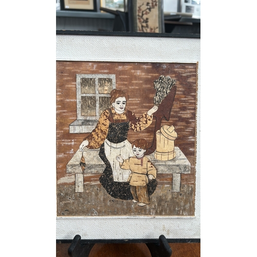 438 - Pair of Russian birch-bark marquetry panels depicting rustic interiors: a girl washing berries besid... 