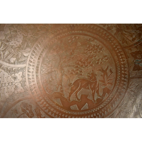 464 - A large Chinese bronzed brass engraved Benares top / tray.Engraved with various animals and flora. l... 