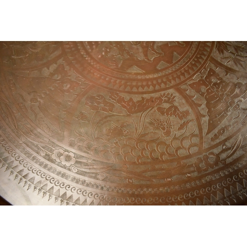 464 - A large Chinese bronzed brass engraved Benares top / tray.Engraved with various animals and flora. l... 