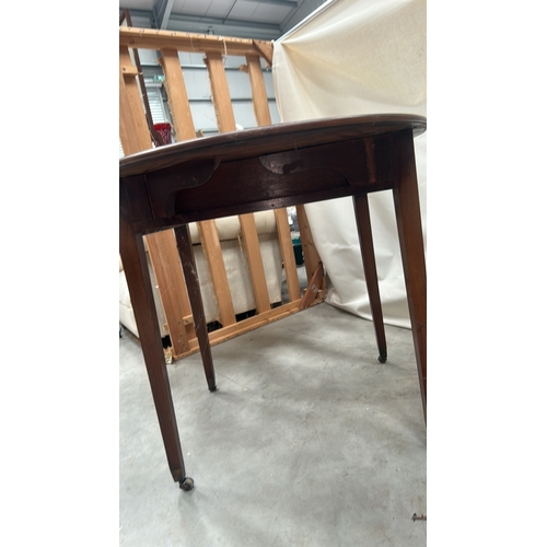 21 - Mahogany Pembroke table, the rectangular top with rounded drop leaves forming an oval, single frieze... 