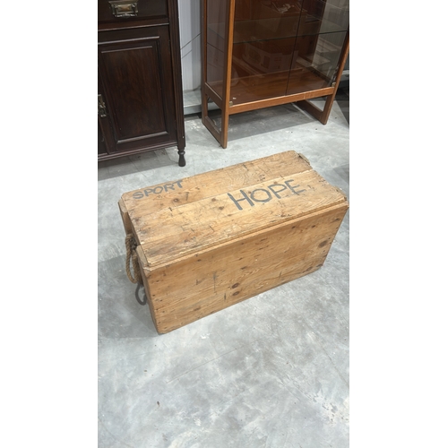 175 - Rectangular pine plank chest with removable top, stencilled “SPORT HOPE” across the lid, rope handle... 