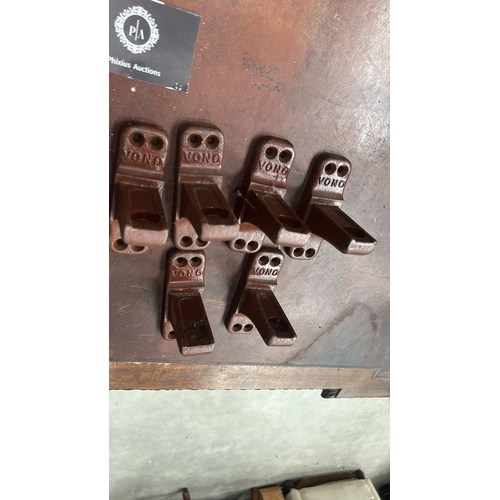 178 - Set of 6 brown-painted cast iron bed-rail angle brackets, each embossed 