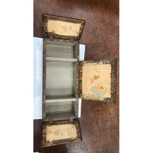 179 - Rectangular wooden trinket box clad in lizard-pattern leather, three hinged lids opening to a partit... 