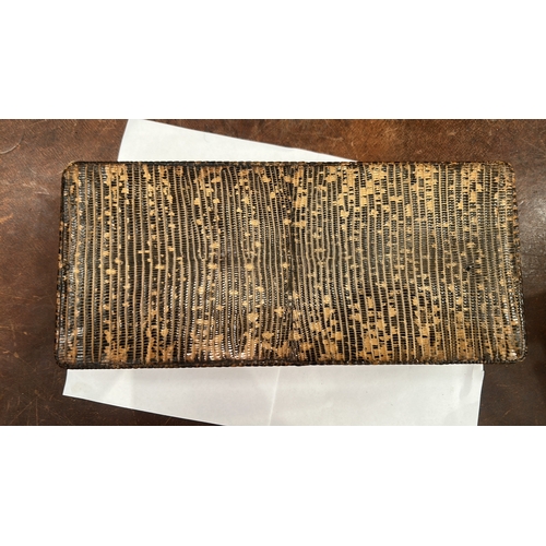 179 - Rectangular wooden trinket box clad in lizard-pattern leather, three hinged lids opening to a partit... 