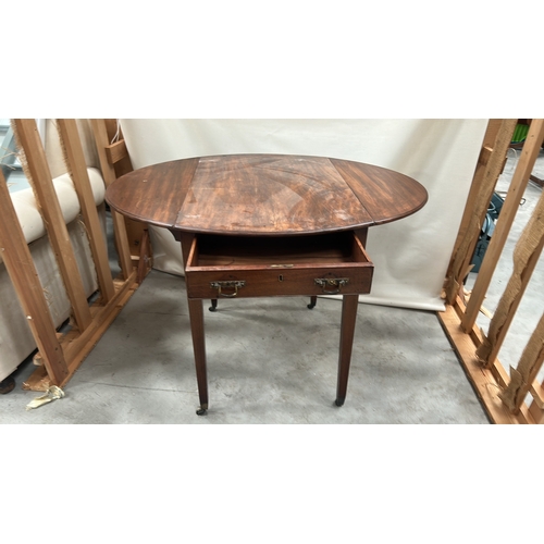 185 - Mahogany Pembroke table, the rectangular top with rounded drop leaves forming an oval, single frieze... 