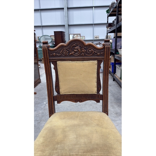 203 - Carved walnut side chair, late Victorian, serpentine crest with foliate and griffin relief, padded b... 