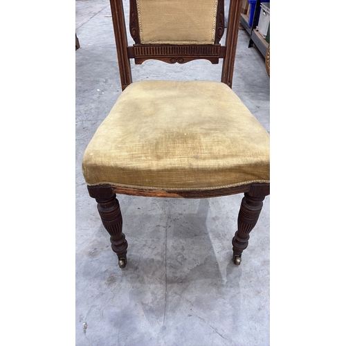 203 - Carved walnut side chair, late Victorian, serpentine crest with foliate and griffin relief, padded b... 