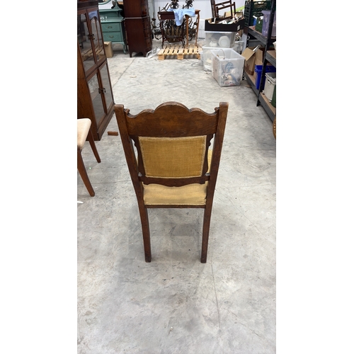 203 - Carved walnut side chair, late Victorian, serpentine crest with foliate and griffin relief, padded b... 
