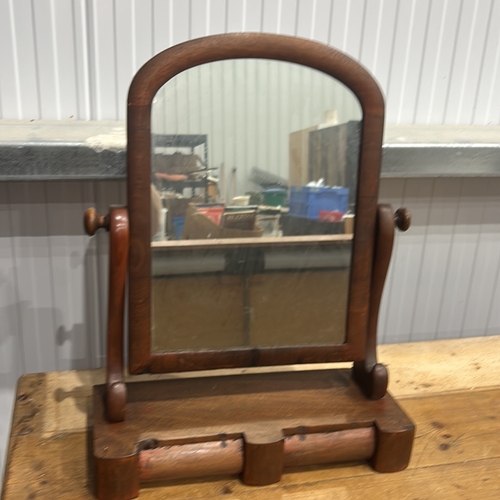206 - Mahogany swing dressing-table mirror, arched plate within turned supports above a shaped base fitted... 
