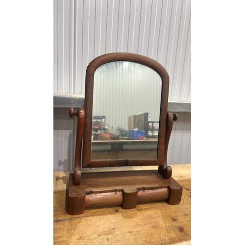 206 - Mahogany swing dressing-table mirror, arched plate within turned supports above a shaped base fitted... 