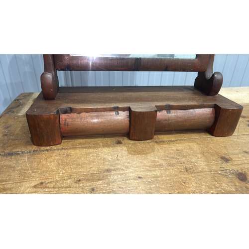 206 - Mahogany swing dressing-table mirror, arched plate within turned supports above a shaped base fitted... 