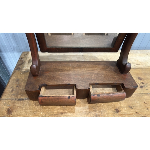206 - Mahogany swing dressing-table mirror, arched plate within turned supports above a shaped base fitted... 
