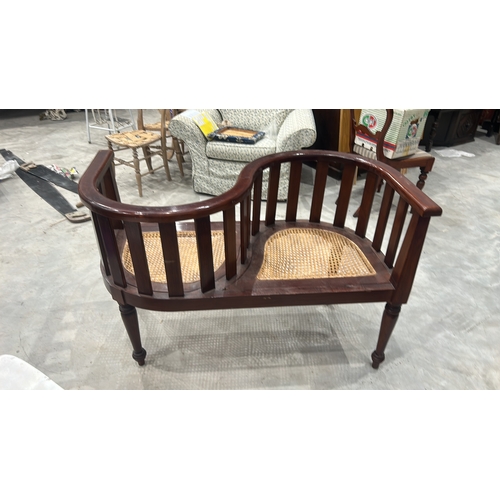 209 - Colonial-style mahogany tête-à-tête conversation bench with serpentine spindle backrest and twin wov... 