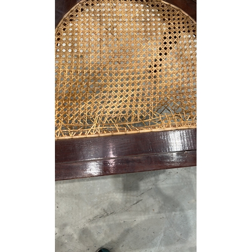 209 - Colonial-style mahogany tête-à-tête conversation bench with serpentine spindle backrest and twin wov... 