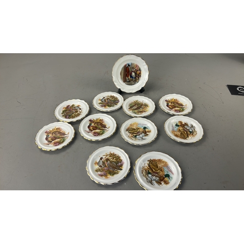 105 - Set of eleven English bone china side plates by Royal Stafford, each scallop-rimmed with gilded edge... 