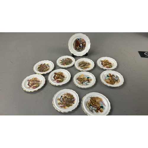 105 - Set of eleven English bone china side plates by Royal Stafford, each scallop-rimmed with gilded edge... 