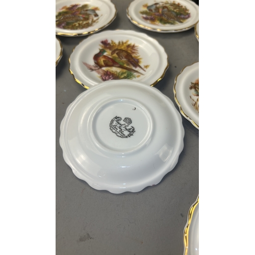 105 - Set of eleven English bone china side plates by Royal Stafford, each scallop-rimmed with gilded edge... 