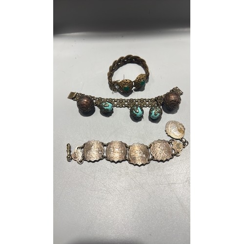 131 - Group of three Chinese export-style gilt metal bracelets: braided rope filigree example with green c... 