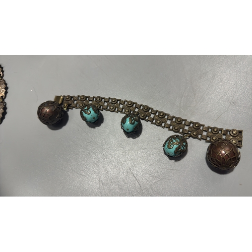 131 - Group of three Chinese export-style gilt metal bracelets: braided rope filigree example with green c... 