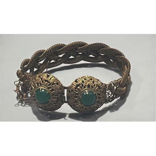 131 - Group of three Chinese export-style gilt metal bracelets: braided rope filigree example with green c... 