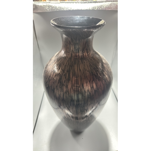 132 - Black and copper-toned blown art glass vase with flared rim, slender neck and ovoid body, decorated ... 