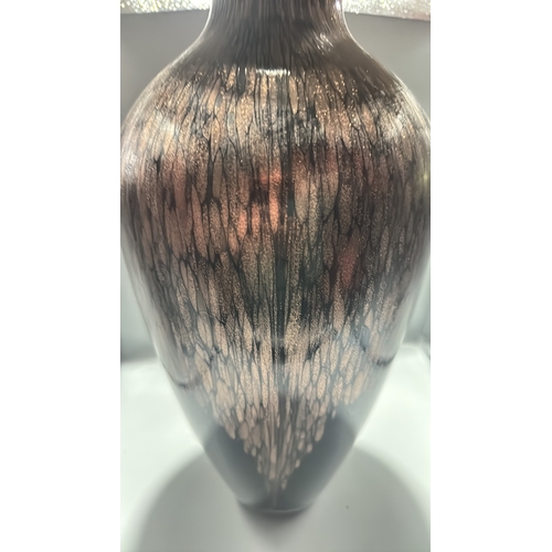 132 - Black and copper-toned blown art glass vase with flared rim, slender neck and ovoid body, decorated ... 
