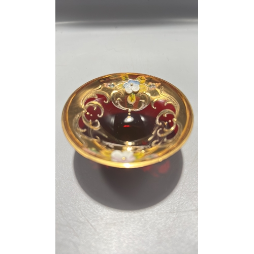 136 - Ruby red Italian glass miniature pedestal bowl, richly gilt with scrollwork and applied polychrome e... 