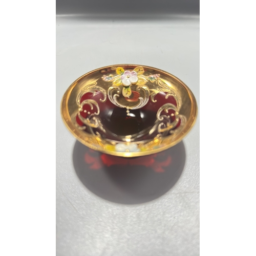 136 - Ruby red Italian glass miniature pedestal bowl, richly gilt with scrollwork and applied polychrome e... 