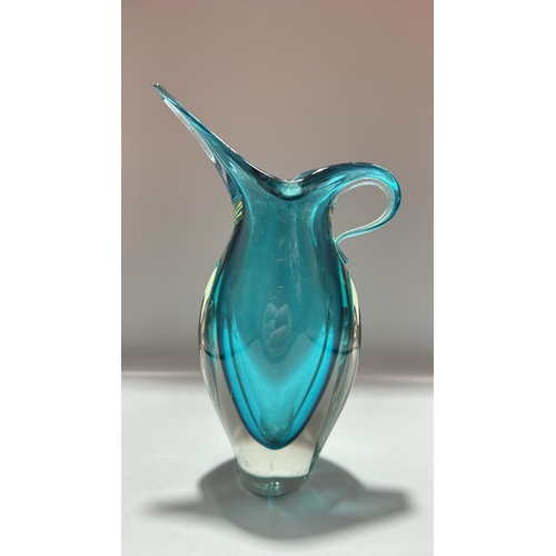159 - Turquoise sommerso art glass piece comprising a sculptural pitcher with elongated spout and integral... 