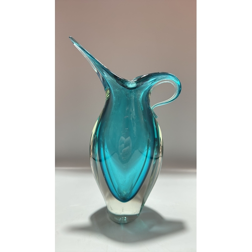 159 - Turquoise sommerso art glass piece comprising a sculptural pitcher with elongated spout and integral... 