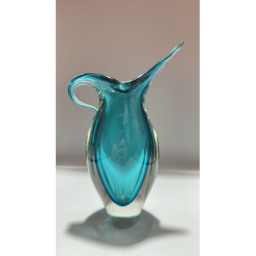 159 - Turquoise sommerso art glass piece comprising a sculptural pitcher with elongated spout and integral... 