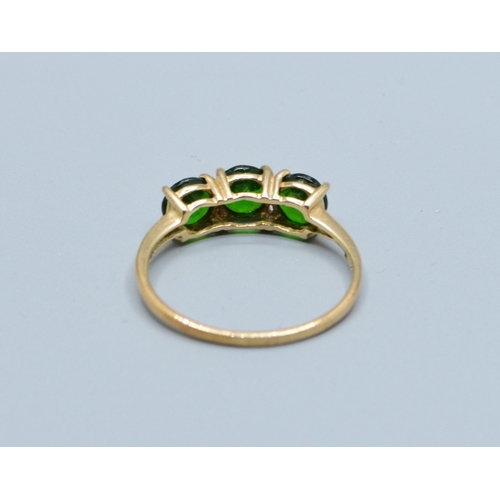 18 - 9ct gold ladies 3 stone Diopside dress ring held in a claw design size S,