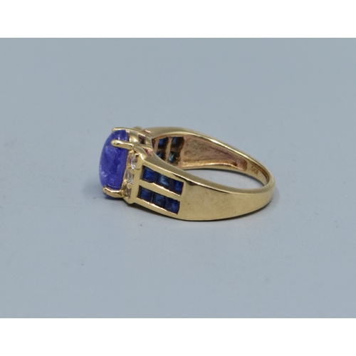 78 - 9ct gold ladies cabochon unpolished Amethyst ring with Amethyst and clear gem set decoration to the ... 