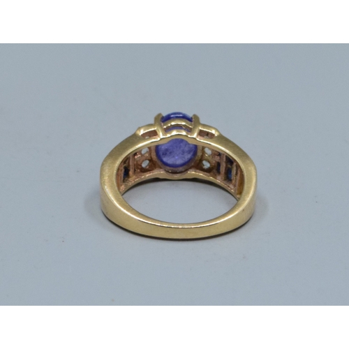 78 - 9ct gold ladies cabochon unpolished Amethyst ring with Amethyst and clear gem set decoration to the ... 