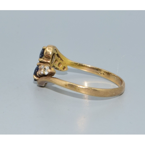 106 - 9ct gold ladies twin stone sapphire ring in a twist design with clear stone enhancement size Q 2.4gr... 