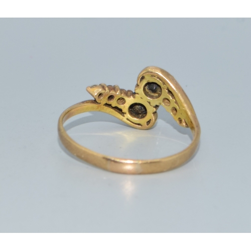 106 - 9ct gold ladies twin stone sapphire ring in a twist design with clear stone enhancement size Q 2.4gr... 