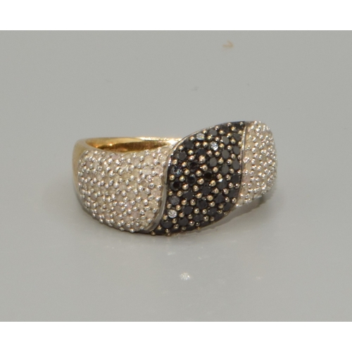 110 - 9ct gold ladies Twin colour Diamond statement ring in a wave pattern hall marked as Diamond  size P,... 