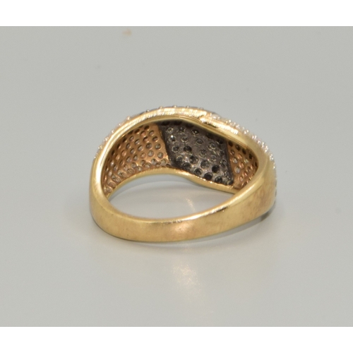 110 - 9ct gold ladies Twin colour Diamond statement ring in a wave pattern hall marked as Diamond  size P,... 