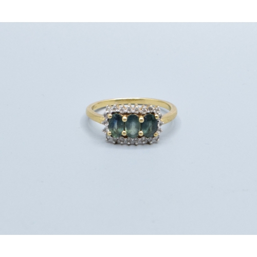 121 - 9ct gold ladies three stone Tourmaline oblong halo ring with clear gem stone decoration head size 14... 