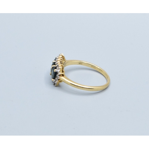 121 - 9ct gold ladies three stone Tourmaline oblong halo ring with clear gem stone decoration head size 14... 