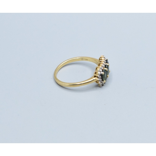 121 - 9ct gold ladies three stone Tourmaline oblong halo ring with clear gem stone decoration head size 14... 