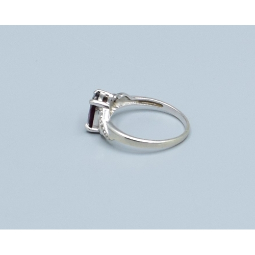 125 - 9ct white gold TGGC oval Garnet and Diamond shoulder ring size O, 2.5grams