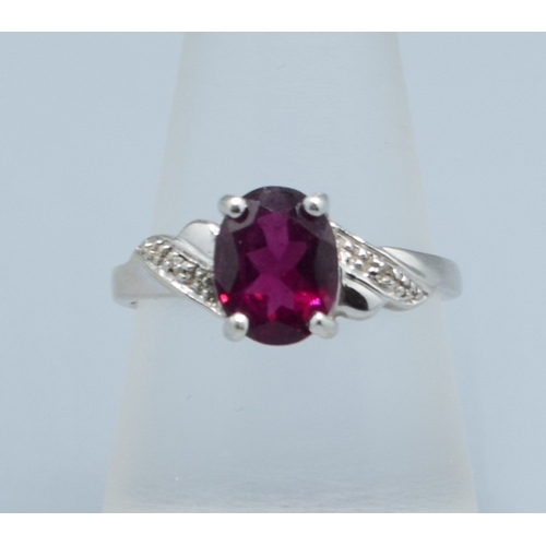 125 - 9ct white gold TGGC oval Garnet and Diamond shoulder ring size O, 2.5grams