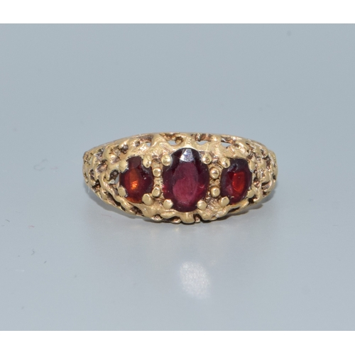200 - 9ct gold Antique 3 stone Garnet ring in an open work setting size N, 4.0grams