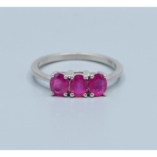 241 - 9ct white gold ladies 3 stone Ruby ring size N