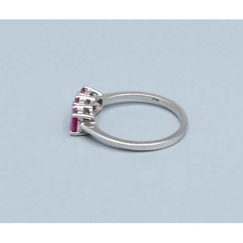 241 - 9ct white gold ladies 3 stone Ruby ring size N