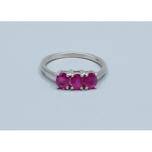 241 - 9ct white gold ladies 3 stone Ruby ring size N